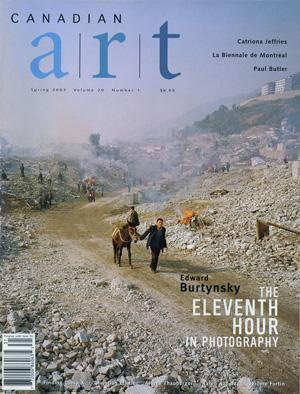 Shot in 2002, Canadian photographer Edward Burtynsky, captures "Feng Jie #5". Depicting a demolished landscape, the photograph is marked by piles of rubble and a dusty haze that obscures the background. Centered in the middle of the work is a man leading his donkey down a dirt road amidst the destruction.