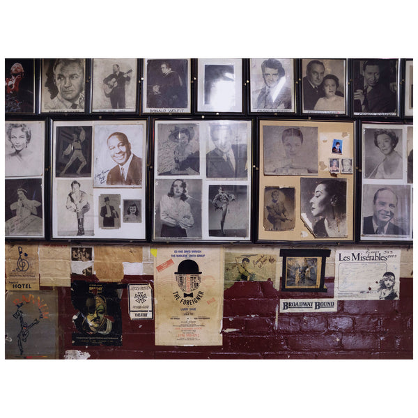 Edward Burtynsky "The Royal Alexandra Theatre Portfolio, 2007” Canada, 2007. Chromogenic print. In this image, Burtynsky captures the details of a collage made of historical cast photos backstage. The wall is covered with headshots and clippings of famous alumni who have performed at the theatre over the years. Below the portraits is a collection of posters from past productions including the musical Les Misérables and a festival devoted to Brecht.