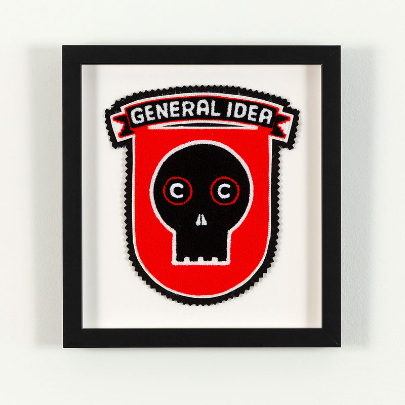 General Idea "Eye of the Beholder" Chenille crest, 1989. Editioned series by Famous Canadian artist trio, which features their iconic skull motif against a florescent red background.