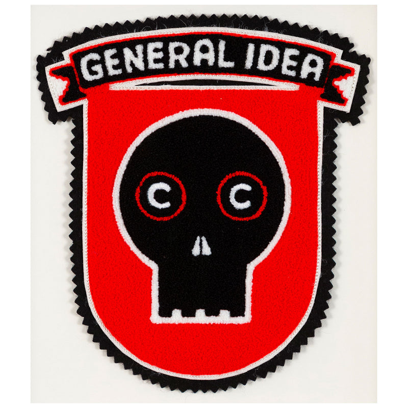 General Idea "Eye of the Beholder" Chenille crest, 1989. Editioned series by Famous Canadian artist trio, which features their iconic skull motif against a florescent red background.