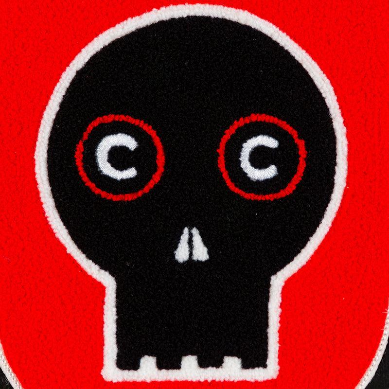 General Idea "Eye of the Beholder" Chenille crest, 1989. Editioned series by Famous Canadian artist trio, which features their iconic skull motif against a florescent red background.