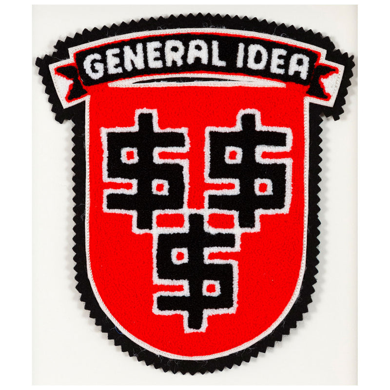 General Idea "Lucre" Chenille Crest, 1989. Editioned textile art by famous Canadian artist trio, which features three dollar signs set against a florescent red background.