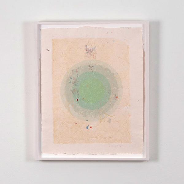 Kenneth Noland. "Circle Series I-35"  USA, 1978  Signed and dated 78 by the artist. The work is composed of five layers of colored pulp with elements of lithography printing. The vibrant celadon green in the center creates a glowing orb against the vanila background. The result is both alluring and hypnotic.
