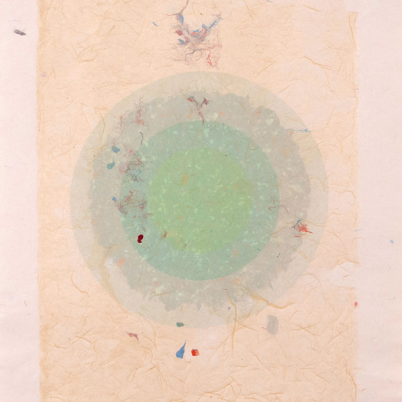 Kenneth Noland. "Circle Series I-35"  USA, 1978  Signed and dated 78 by the artist. The work is composed of five layers of colored pulp with elements of lithography printing. The vibrant celadon green in the center creates a glowing orb against the vanila background. The result is both alluring and hypnotic.