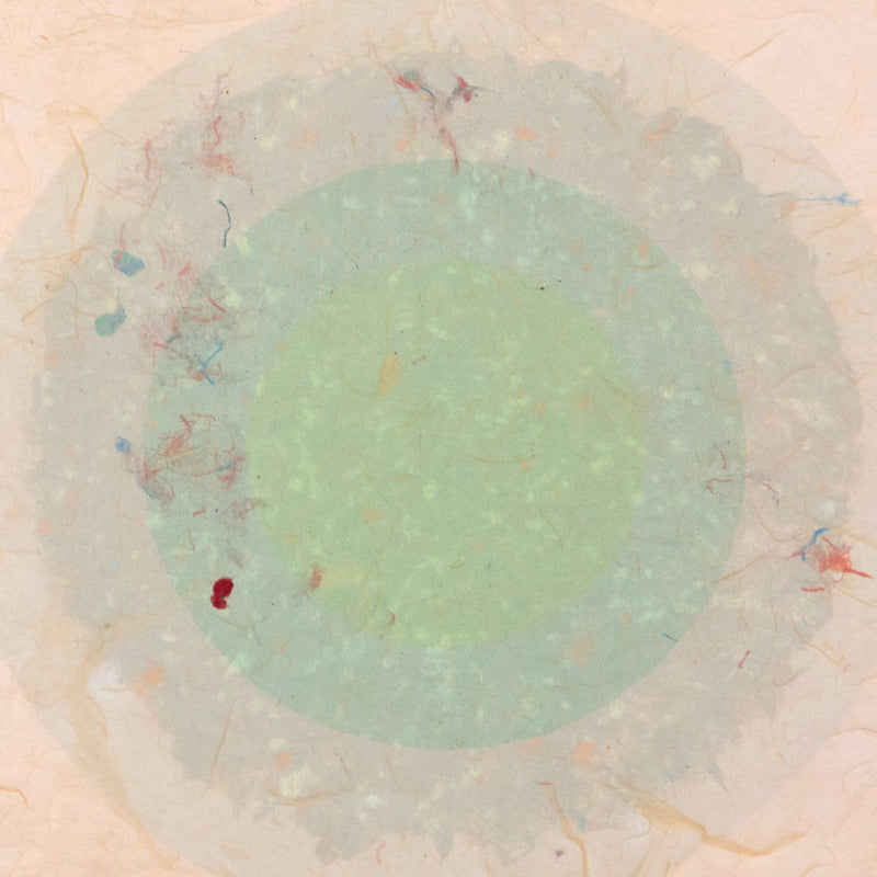 Kenneth Noland. "Circle Series I-35"  USA, 1978  Signed and dated 78 by the artist. The work is composed of five layers of colored pulp with elements of lithography printing. The vibrant celadon green in the center creates a glowing orb against the vanila background. The result is both alluring and hypnotic.