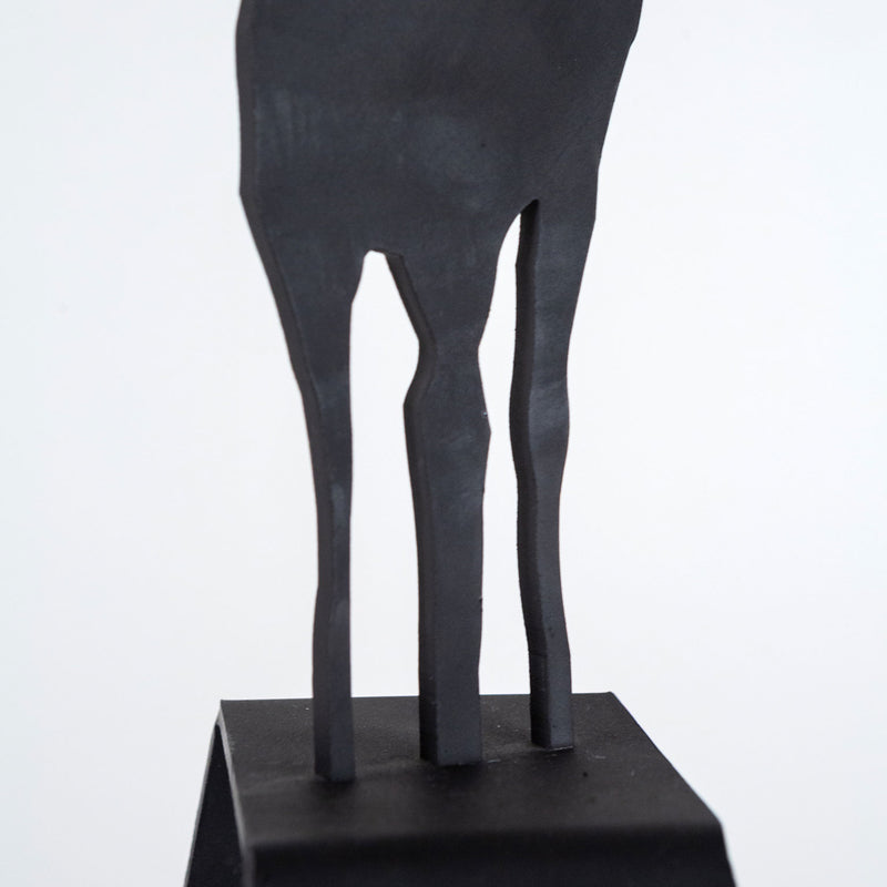 Charles Pachter "Mooseamour 26" Sculpture, 1999. Pachter's Mooseamour is an iconic piece from his oeuvre. This monochromatic piece features a crisp silhouette of a moose which stands on top of a heightened mount. The moose is a recurring motif for Pachter and a key identifier of his "Canadiana" aesthetic.
