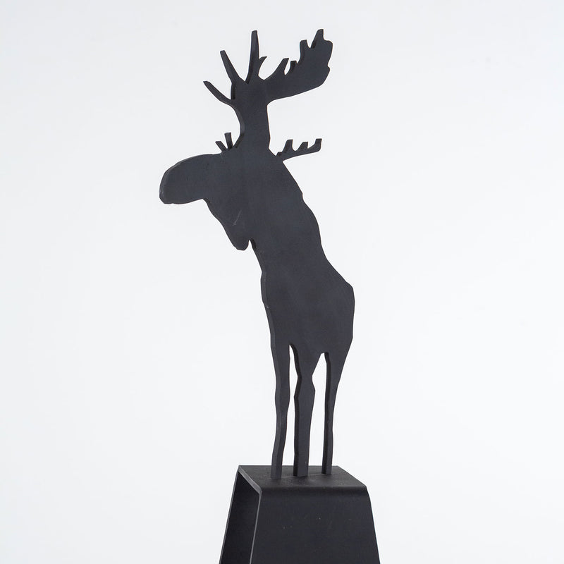 Charles Pachter "Mooseamour 26" Sculpture, 1999. Pachter's Mooseamour is an iconic piece from his oeuvre. This monochromatic piece features a crisp silhouette of a moose which stands on top of a heightened mount. The moose is a recurring motif for Pachter and a key identifier of his "Canadiana" aesthetic.
