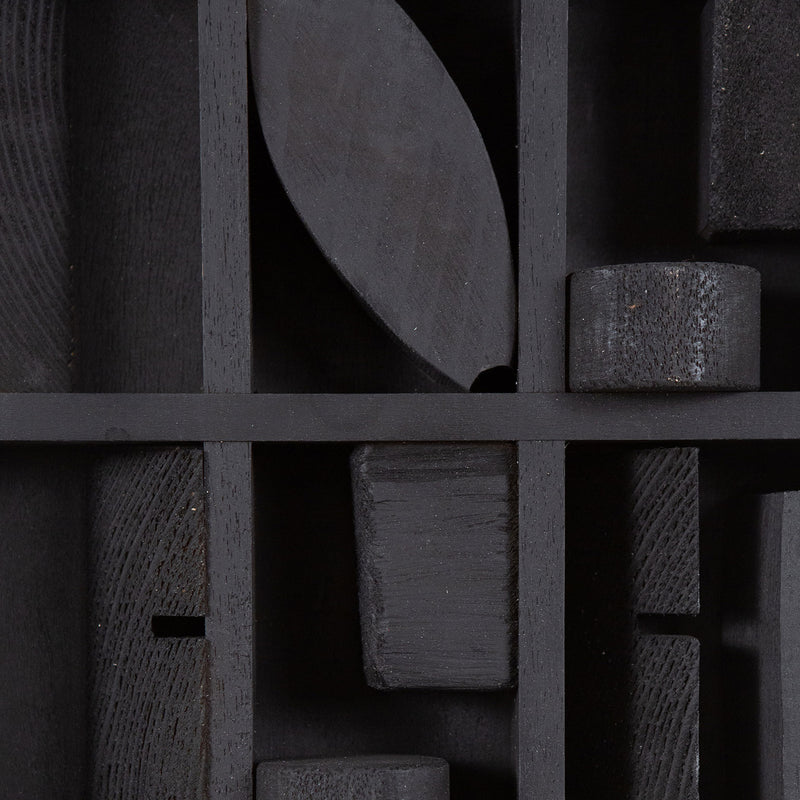 Louise Nevelson "Winter Chord" Mixed media sculpture, 1975. Wood sculpture painted black with unique recesses and curvatures that expose geometric shapes within the form. 