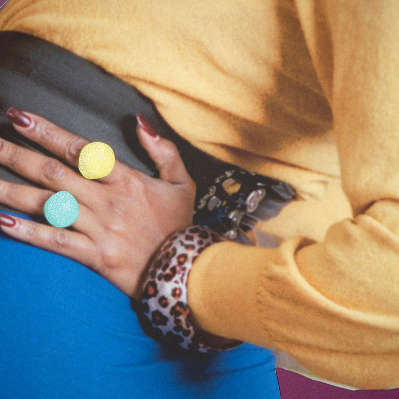 Mickalene Thomas "Keri On" 2019. In this work, Keri's peers over her shoulder at an exaggerated angle, her hand placed firmly on her hip, strengthening her stance as she looks back at the viewer. Typical of Thomas' muses she is both playful and assertive.