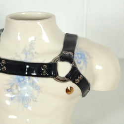 This is a ceramic vase for sale from Caviar20. Made by Pansy Ass and represents a torso with a leather harness.